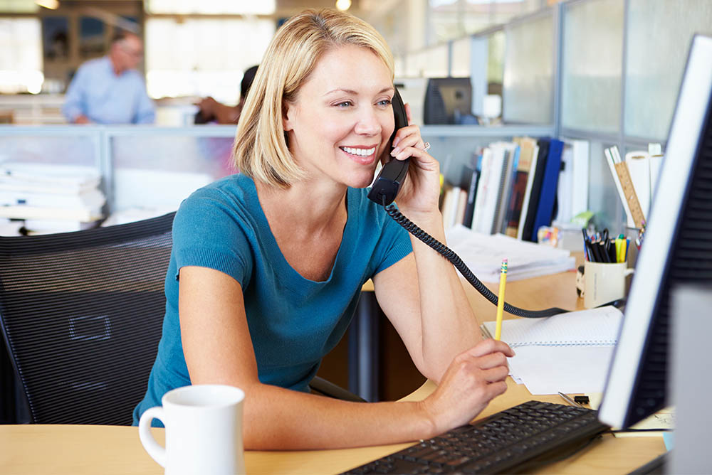 A woman in an office on a call