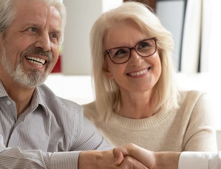 an elderly couple getting financial help