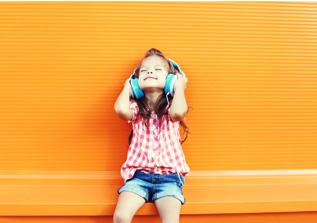 Happy child listening to music