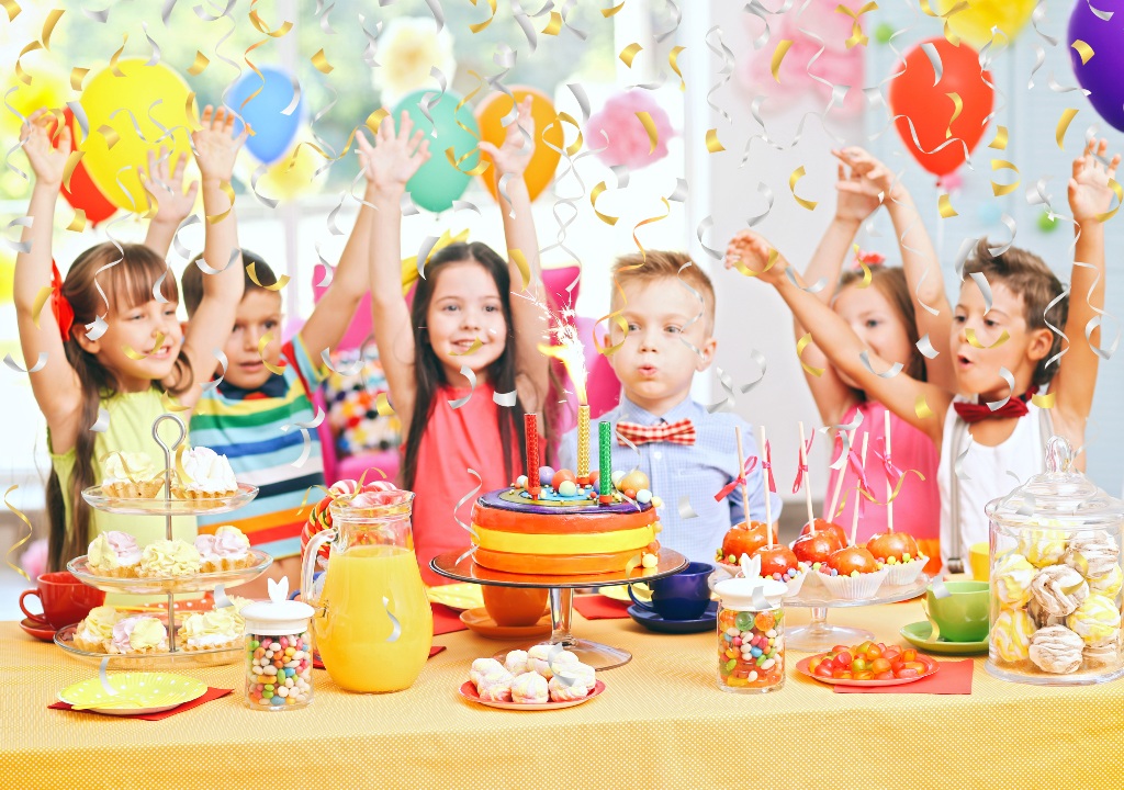 Children at a briight, colourful birthday party