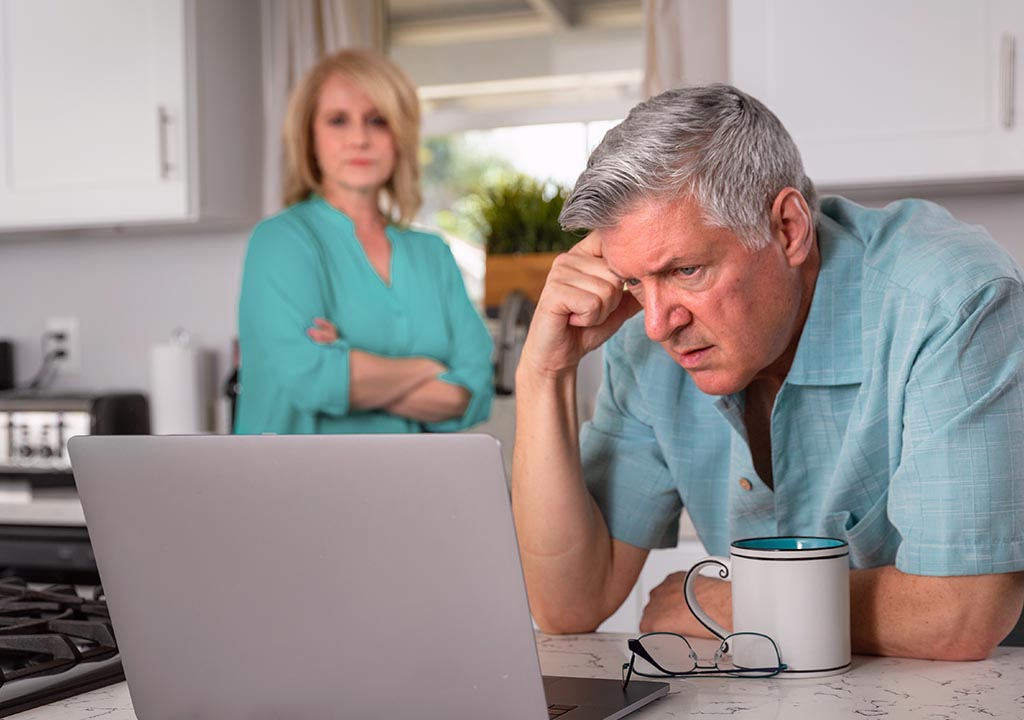 An older couple worry over their mortgage.