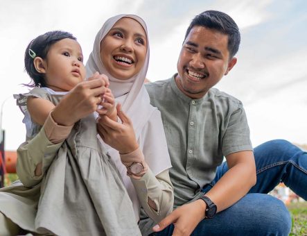 A happy family together outdoors.