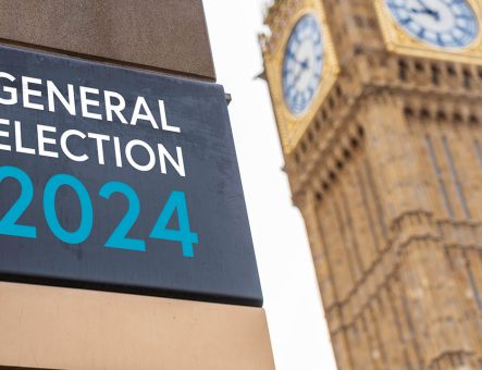 Elizabeth Tower in Westminster with a sign saying "General Election 2024".