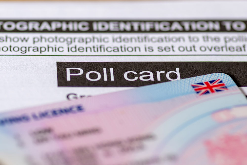 A Poll Card and voter ID.