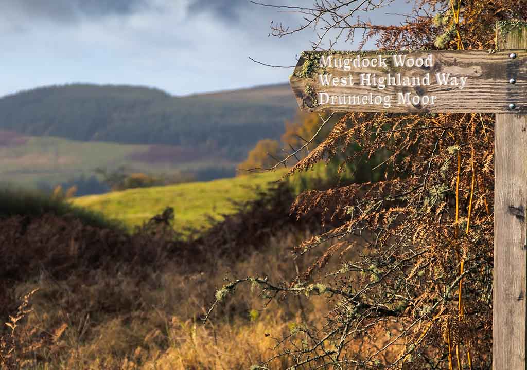 A sign posting to the West Highland Way.